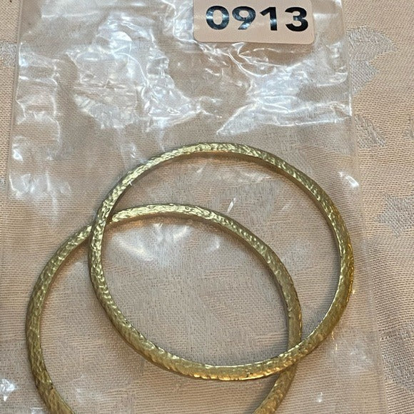 Hammered brass bangles marked KR India