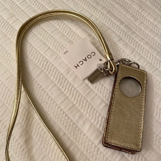 NWT Coach iPod shuffle case with golden strap.