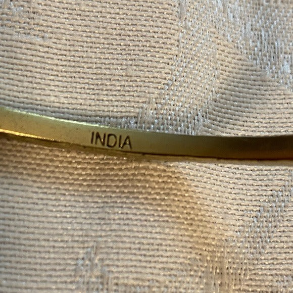 Hammered brass bangles marked KR India